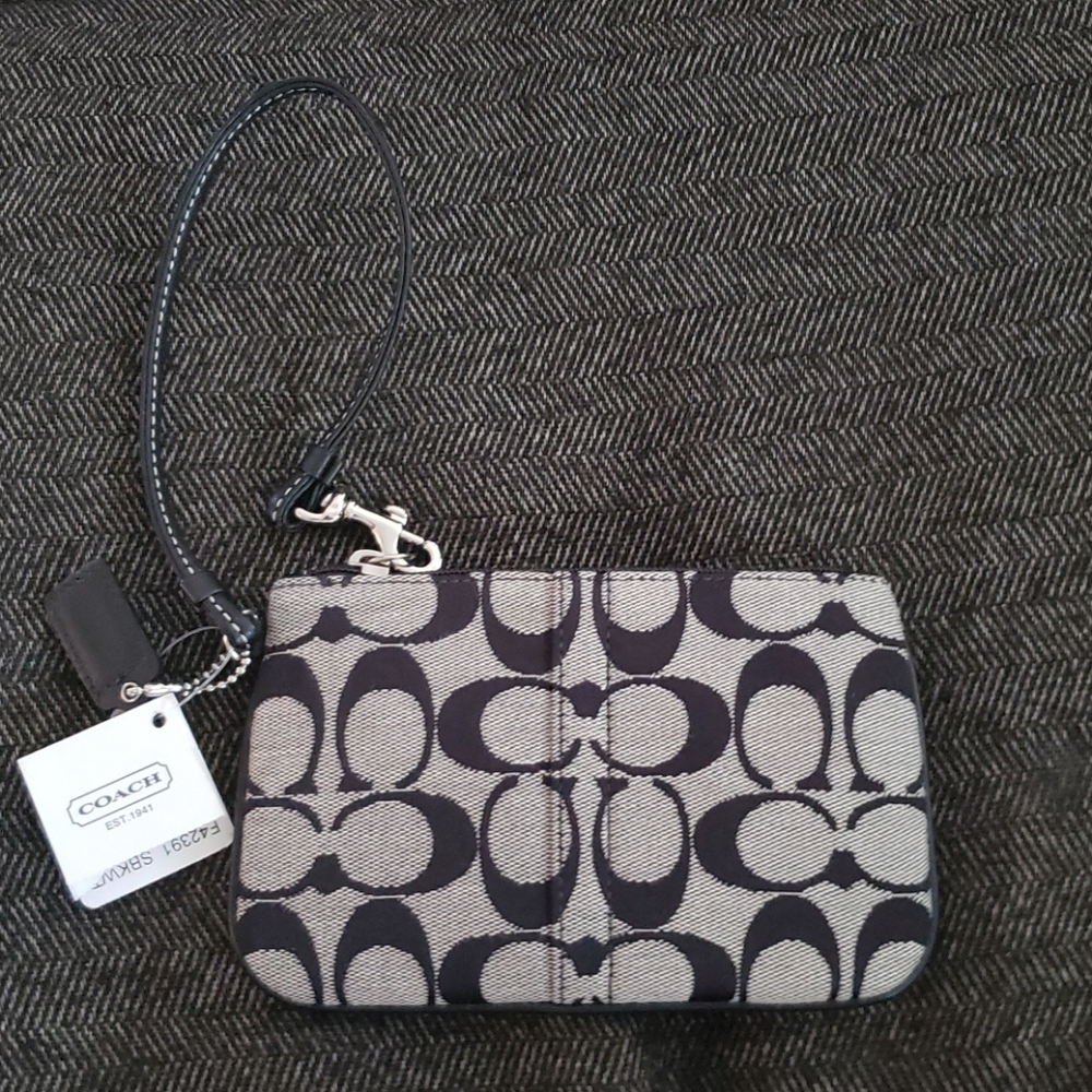 The COACH Signature Collection- wristlet in black